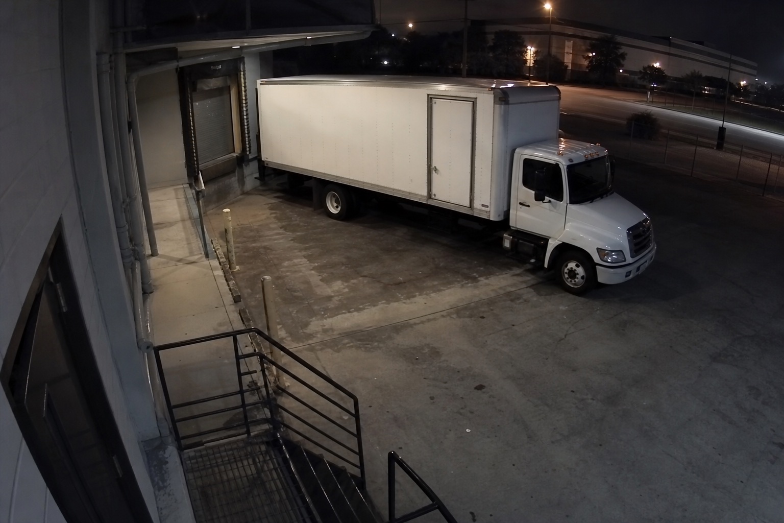 Box truck at a loading dock at night